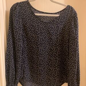 Navy blue blouse with white dots, no size listed, but could most likely fit S-M